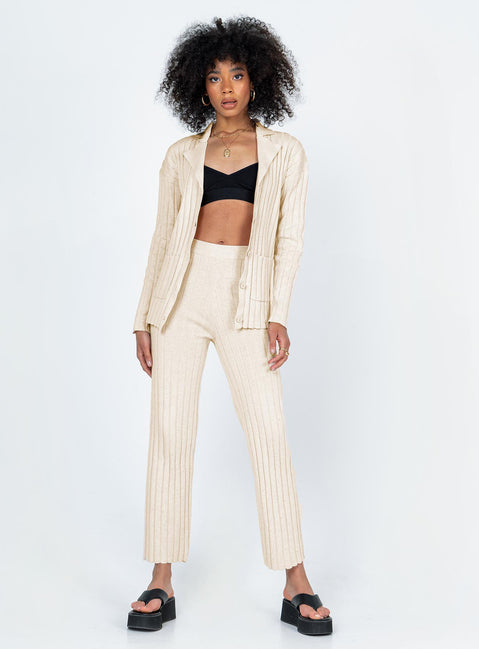 Matching set  Relaxed fit Princess Polly Exclusive 63% recycled polyester 25% polyester 12% nylon Heavy wide ribbed material  Long sleeve button up top   Twin front pockets  High waisted pants  Elasticated waistband Slim leg  Raw-edge hem 