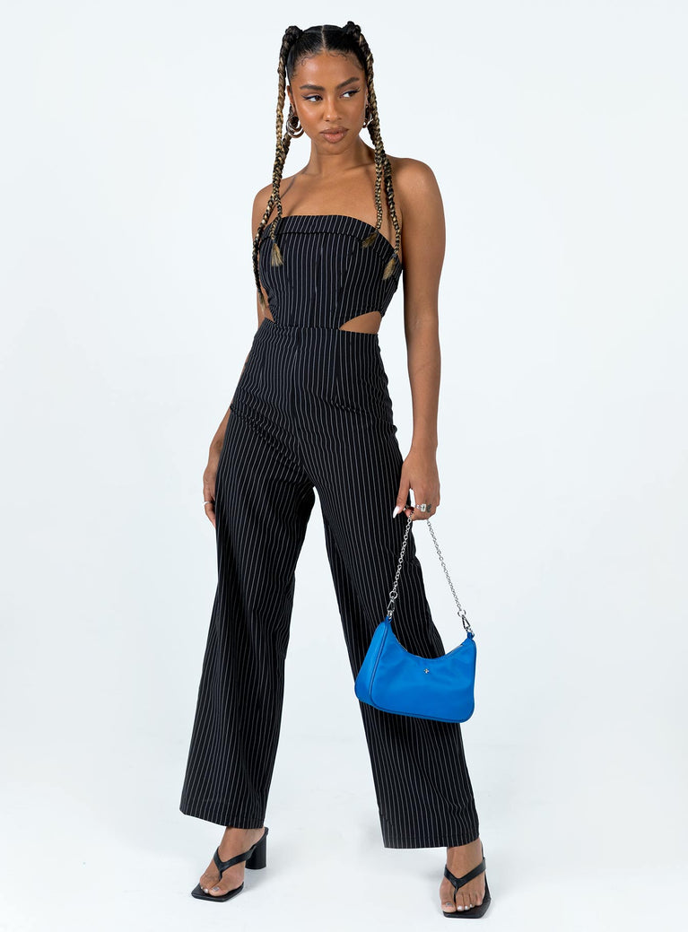 Strapless jumpsuit Pinstripe print Folded neckline Invisible zip fastening at back Boning through bust Elasticated back band Cut out sides Wide leg