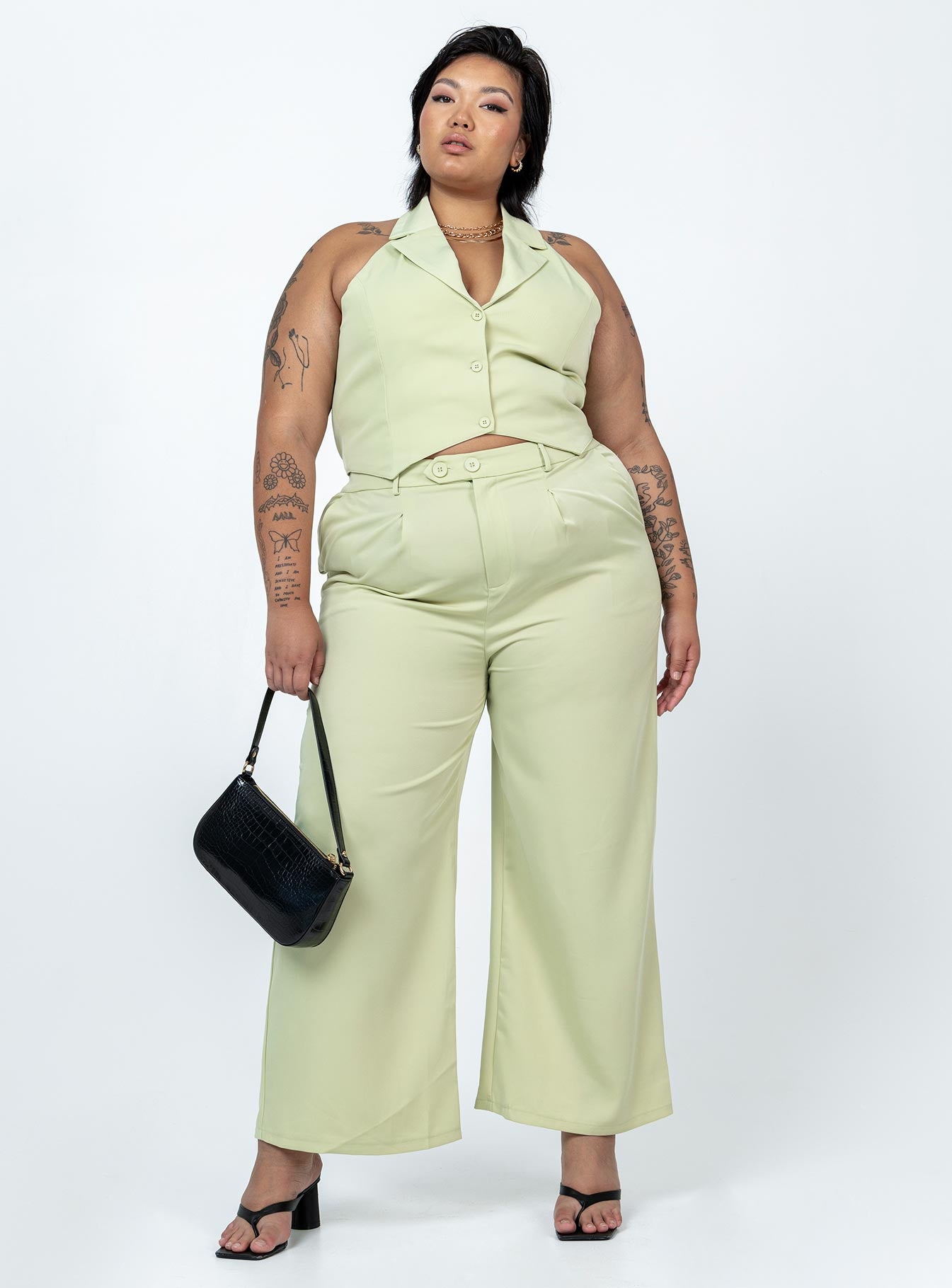 Matching set High waisted pants  Zip & button fastening  Elasticated back band  Belt looped waist  Twin hip pockets Wide leg  Vest top  Lapel collar  Button front fastening 