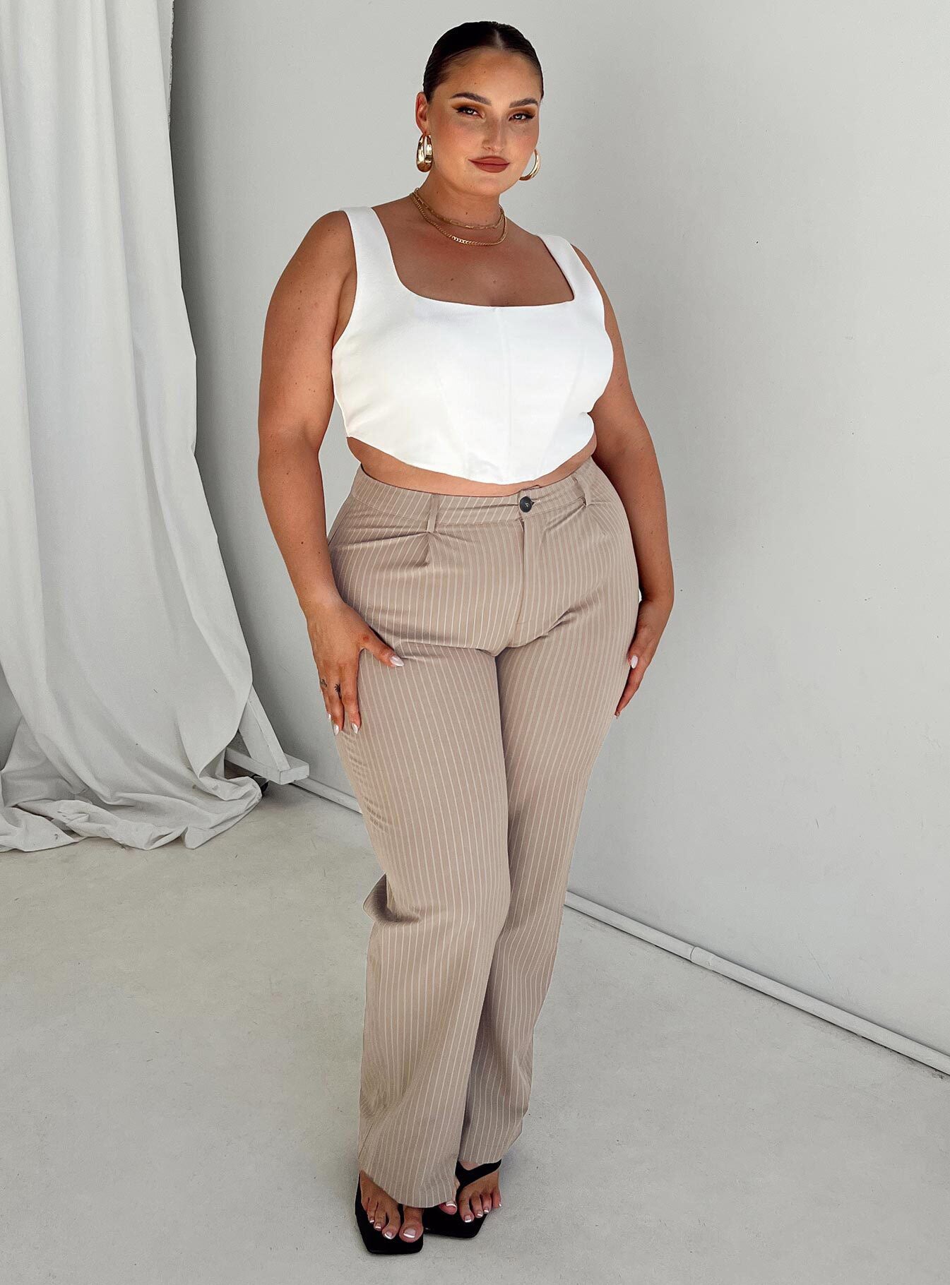 Front view of model wearing  front Princess Polly Sleeveless High Neck  Kaeshia Rib Bustier Curve