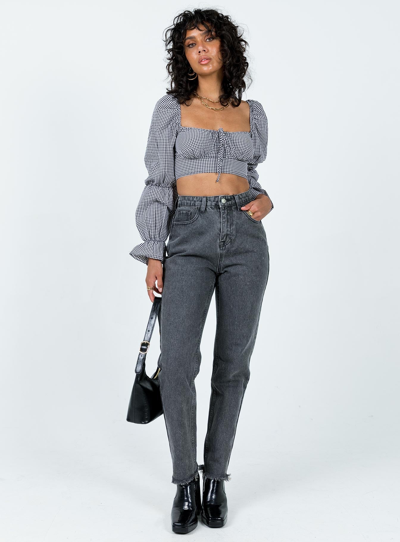 Front view of model wearing  front Princess Polly Full Sleeves High Neck  Bellevue Gingham Top Black / White