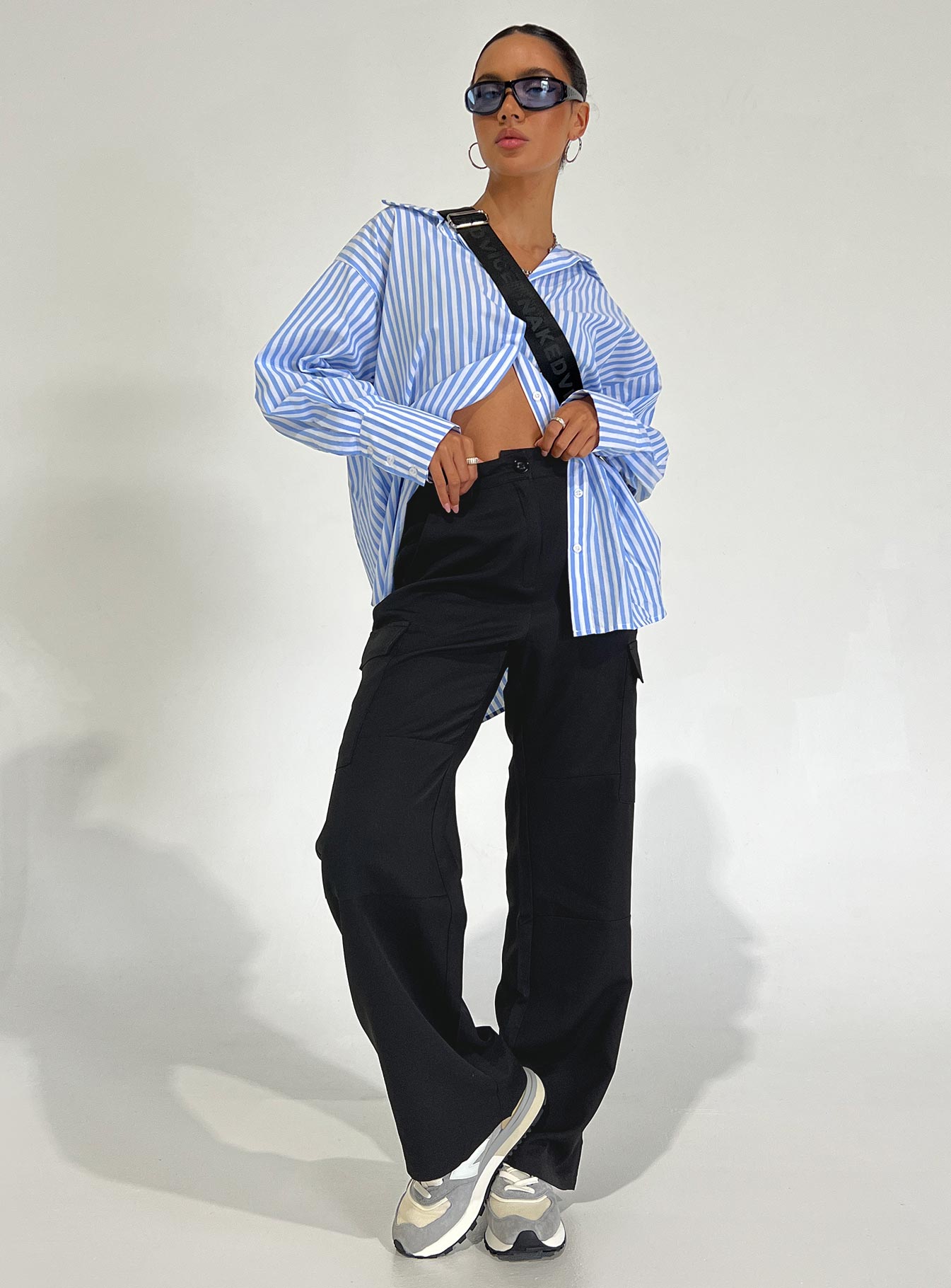 Front view of model wearing  front Princess Polly High Waisted Pants  Kaydence Cargo Pants Black