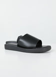 Slides Faux leather material  Single wide upper  Square toe  Padded footbed 