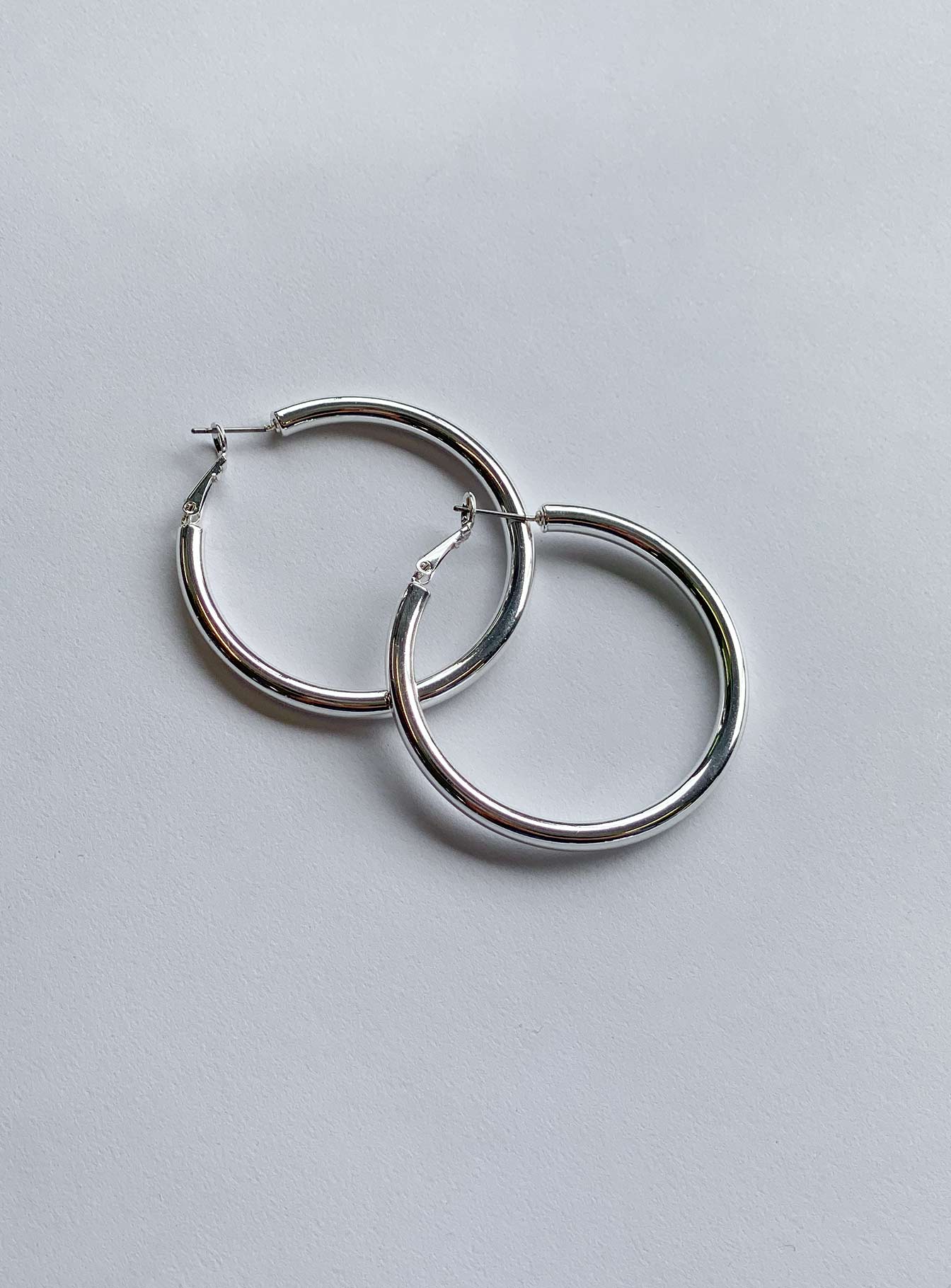 Earrings Silver-toned Latch fastening Oversized hoop design