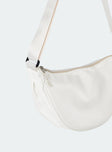 White crossbody bag Nylon material Adjustable strap Zip fastening Internal slip pocket Silver toned hardware