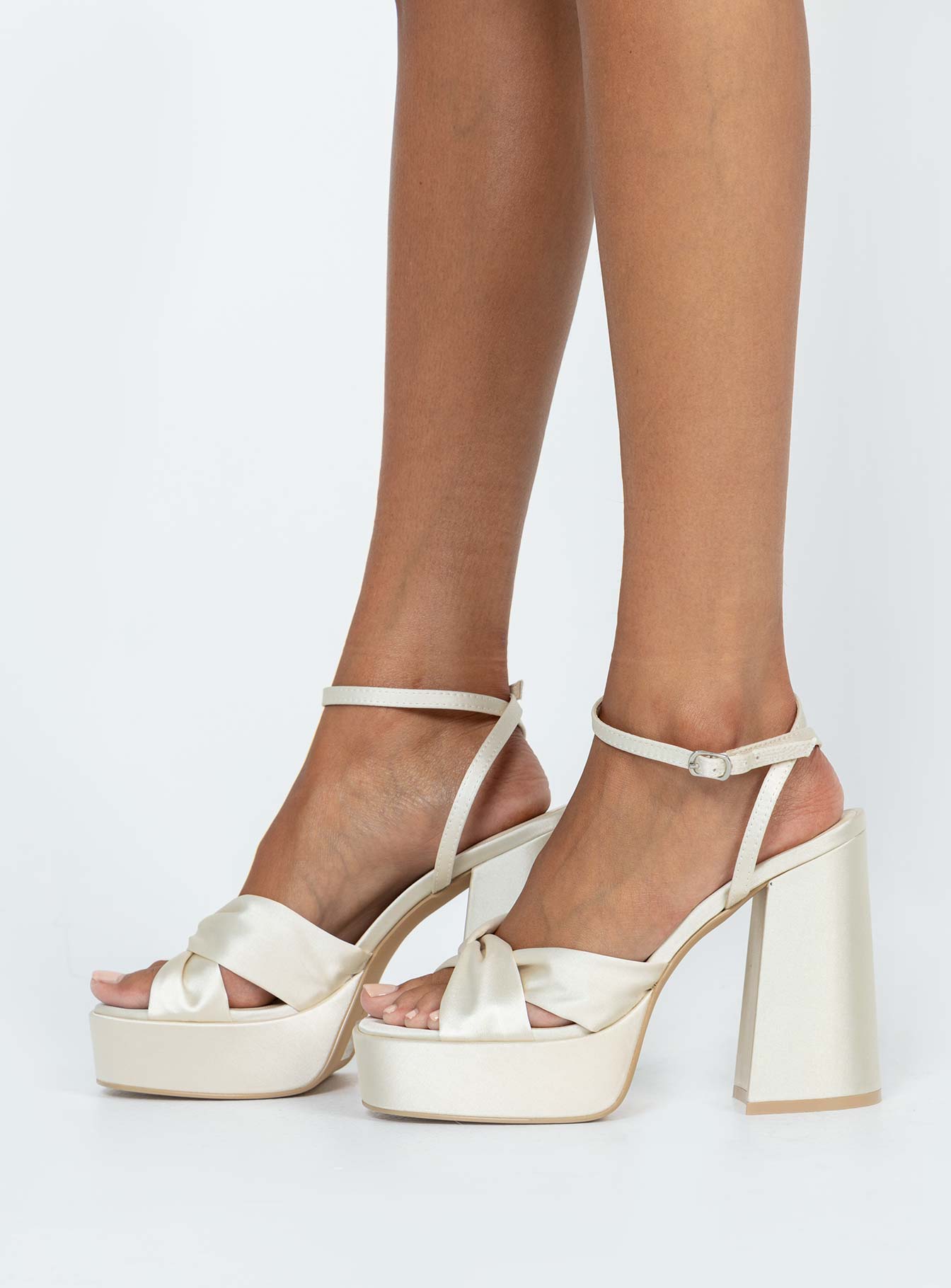 Heels Strappy ankle fastening  Fabric upper  Block heel  Platform base  Padded footbed 