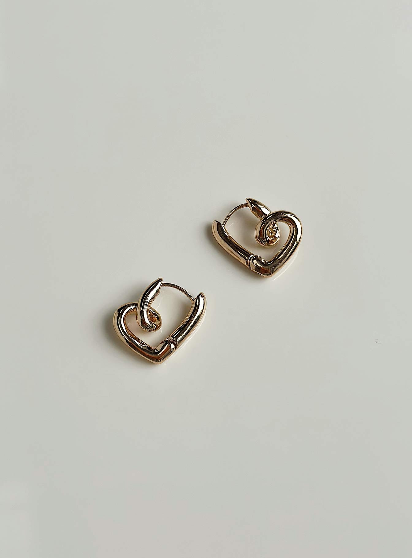 Earrings Gold toned Hinged hoop fastening