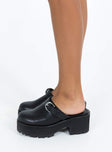 Black flats Faux leather material Closed rounded toe Silver-toned buckle detail Platform base Padded footbed