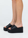 Black platform heels Faux leather material Single wide upper Rounded toe