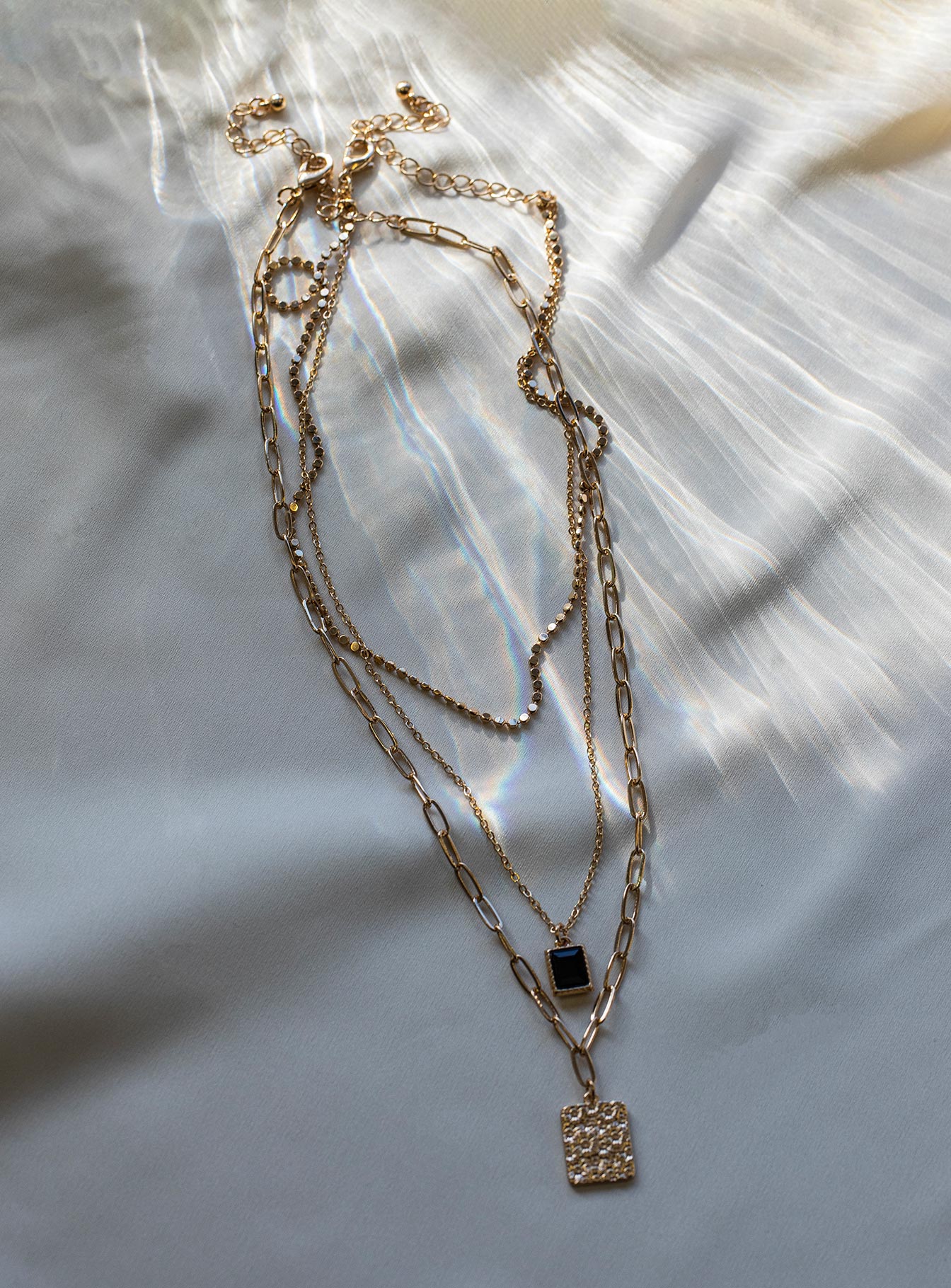 Necklace pack  Princess Polly Exclusive 50% brass 30% steel 15% zinc alloy 5% glass Pack of three  Single chain with pendant  Layered chain - these can not be worn separately  Lobster clasp fastening  Gold-toned 