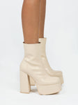 Platform boots Faux matte leather material Zip fastening at side Block heel Rounded toe Padded insole 