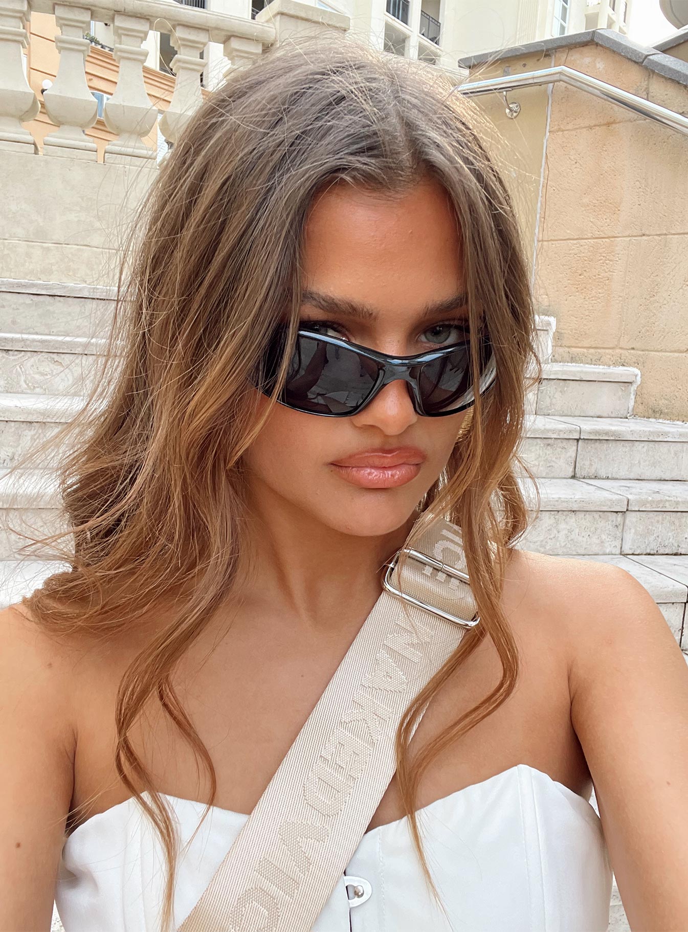 Sunglasses Wrap around design Light weight frame Black tinted lenses Moulded nose bridge