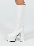 Platform boots Faux leather material Knee-high Zip fastening at side Block heel Rounded toe Treaded sole
