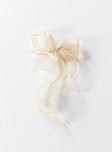 Hair bow  95% polyester 5% iron Sheer sparkly material  Silver-toned hardware  Snap clip fastening 