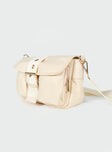 Crossbody bag  Nylon material  Gold-toned hardware  Removable & Adjustable strap Magnetic button fastening  Zip closure Two external pockets  Fully lined  Flat base 