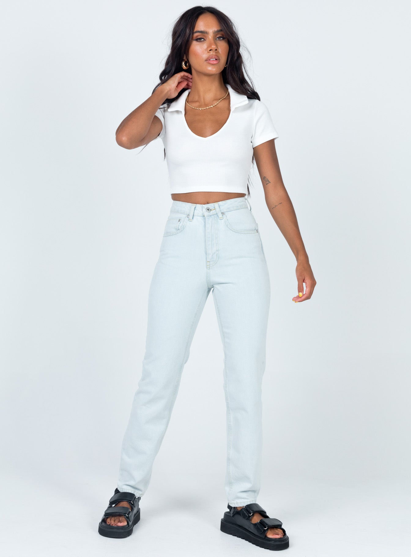 front view of model wearing Princess Polly Ragged Priest Cougar Jeans Stonewash Denim Mid Rise 