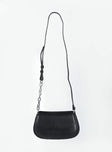 Crossbody bag Faux leather material Fixed adjustable strap Magnetic button fastening Silver-toned hardware Internal pocket with zip fastening