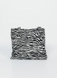Bag  80% polyester 20% cotton Zebra print  Twin handles External & internal pockets Flat base  Magnetic button fastening 