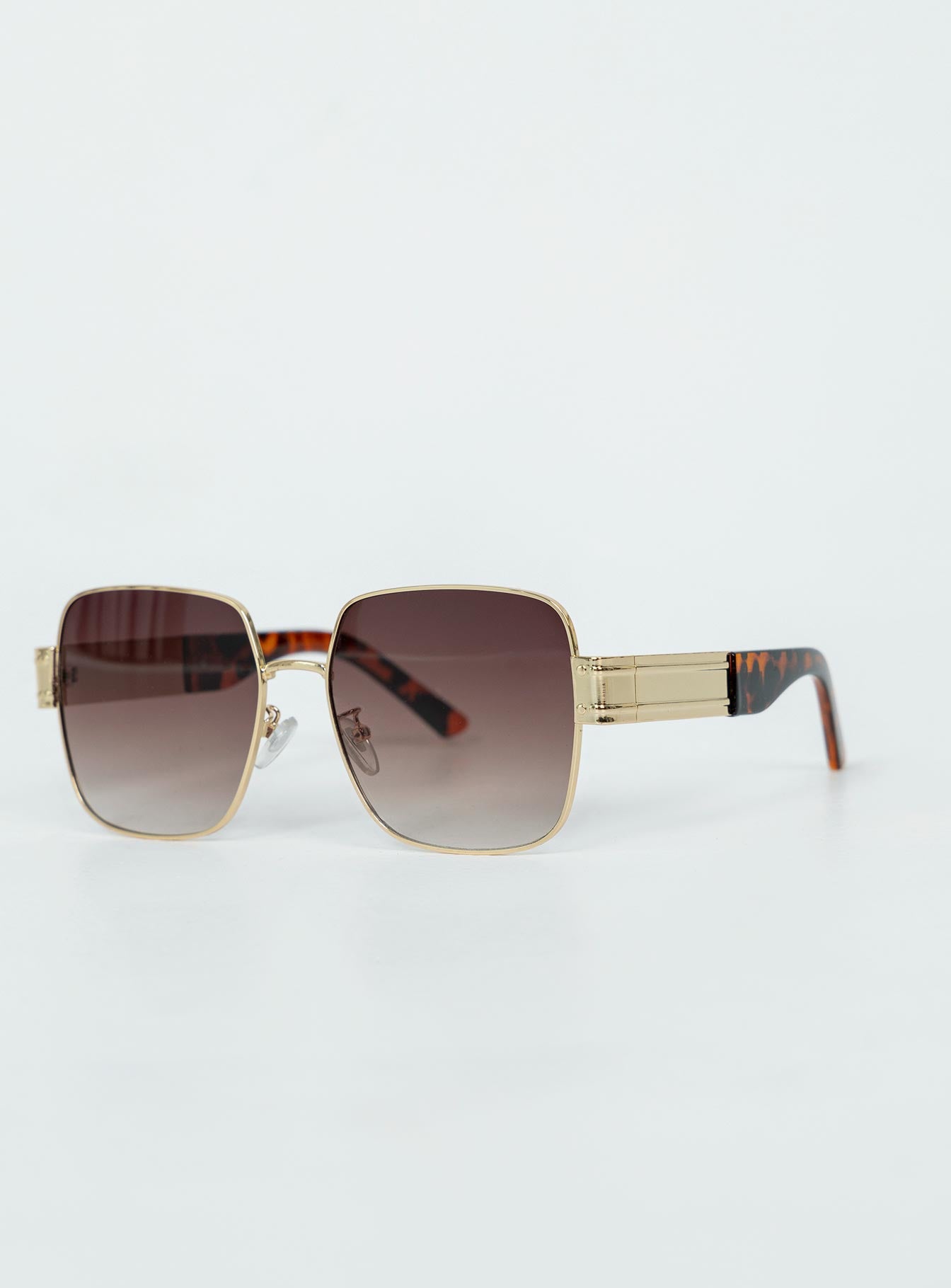 Oversized sunglasses Gold-toned metal frame  Tort arms  Ombre tinted lenses  Adjustable silicone nose pads 