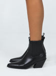 Boots  Faux leather material  Detail stitching  Elasticated ankle  Pull tabs  Angled block heel  Pointed toe  Padded footbed 