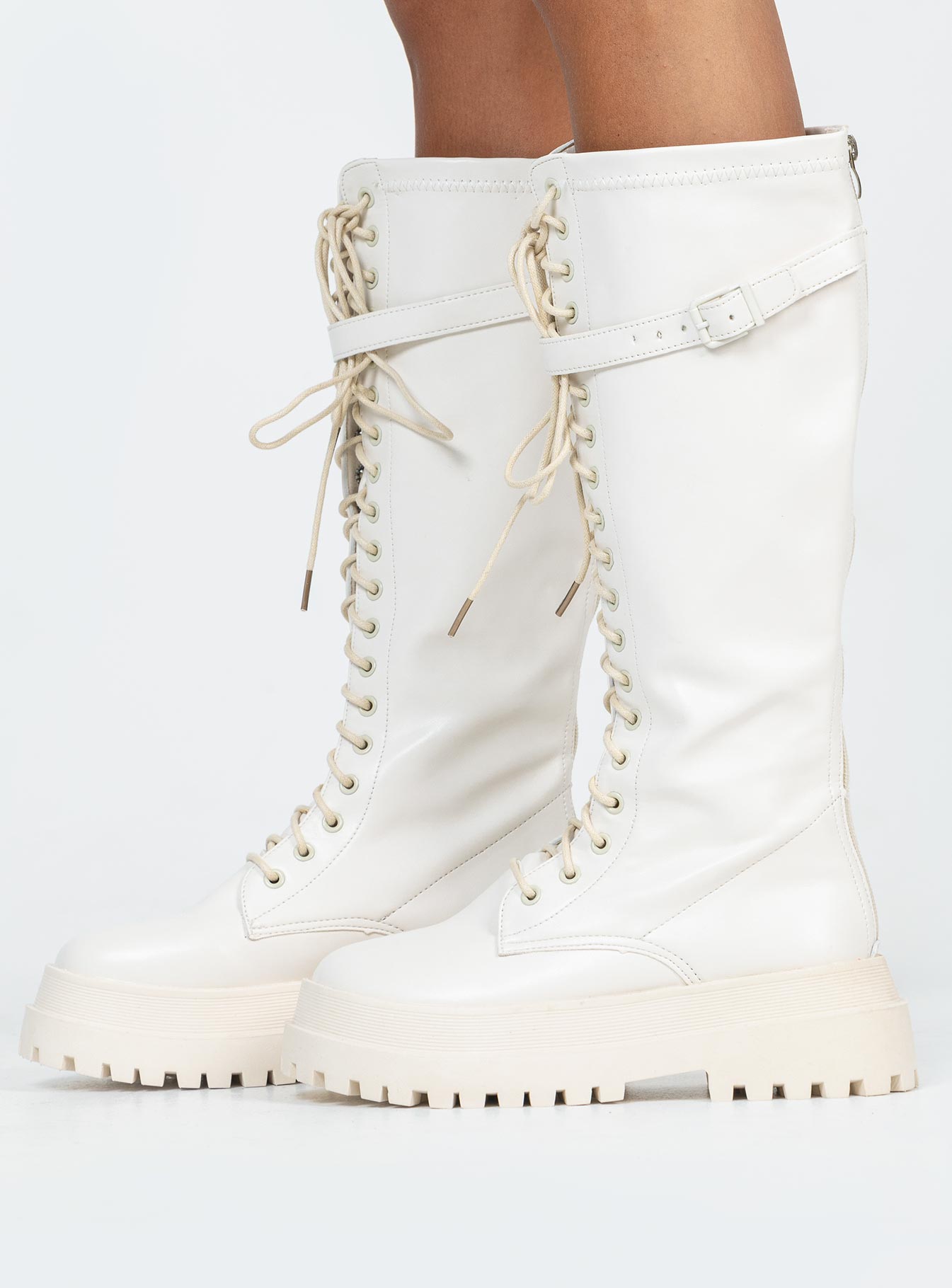 Boots Faux leather material  Zip fastening at back  Lace up front  Buckle strap at top  Platform base  Treaded sole 