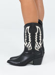 Cowgirl boots Faux leather material  Detail stitching  Mid-calf length  Pull tabs  Pointed toe Block heel 