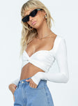 Long sleeve crop top Low cut neckline Knotted bust Tie back fastening Ruched back