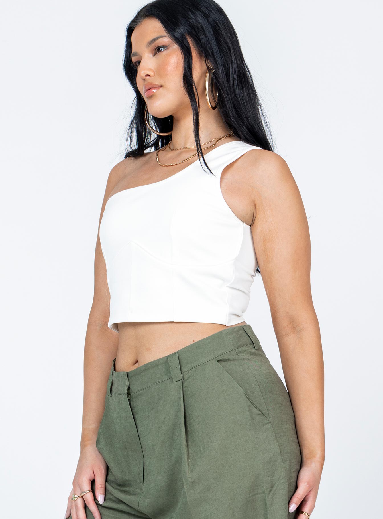 side view of model wearing Princess Polly Meranti Top White Sleeveless Asymmetric Neckline 