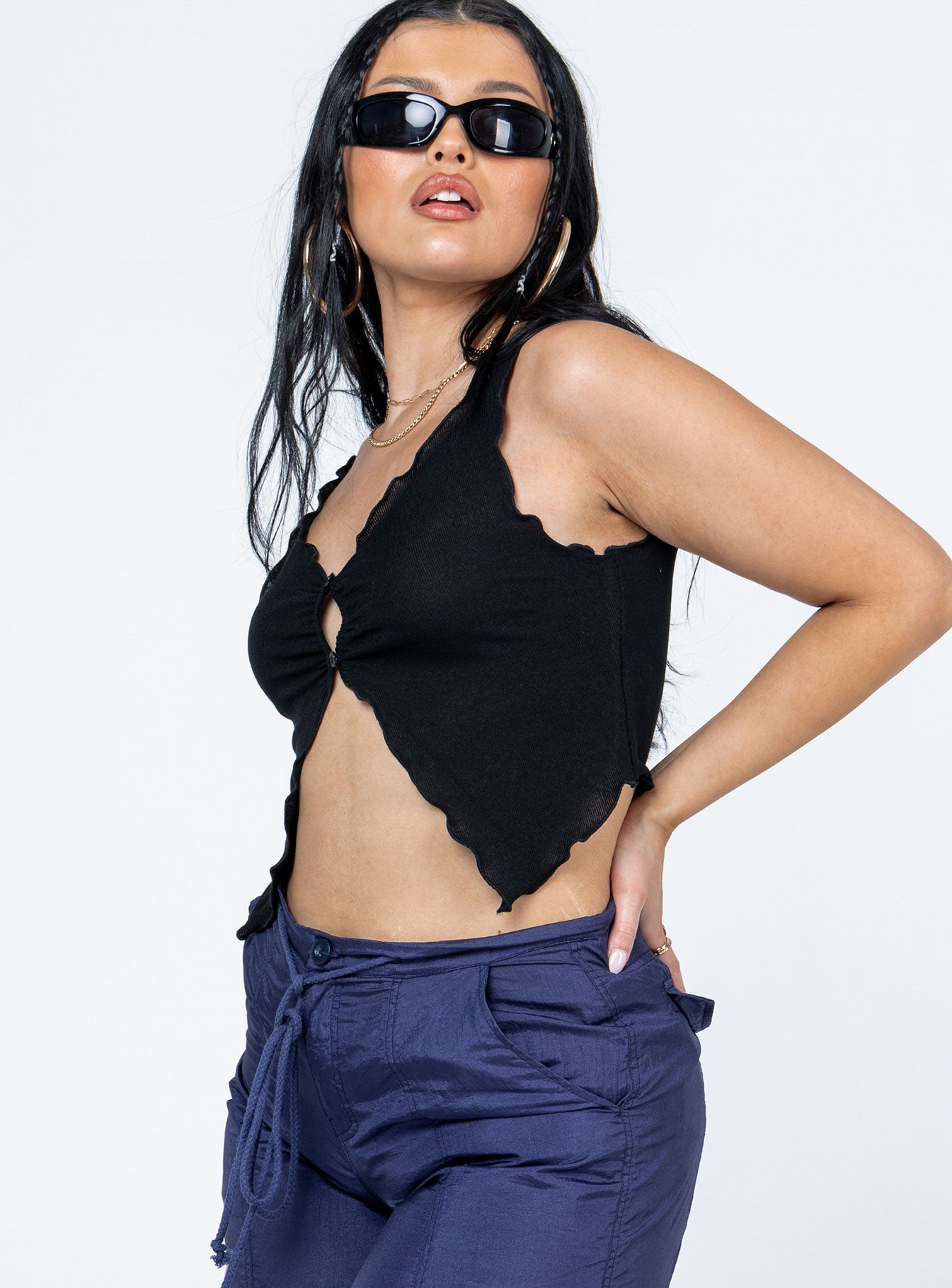 side view of model wearing Princess Polly Amyra Top Black Sleeveless V-Neck 