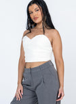 White strapless top 100% polyester  Woven look material  Raw edge neckline 