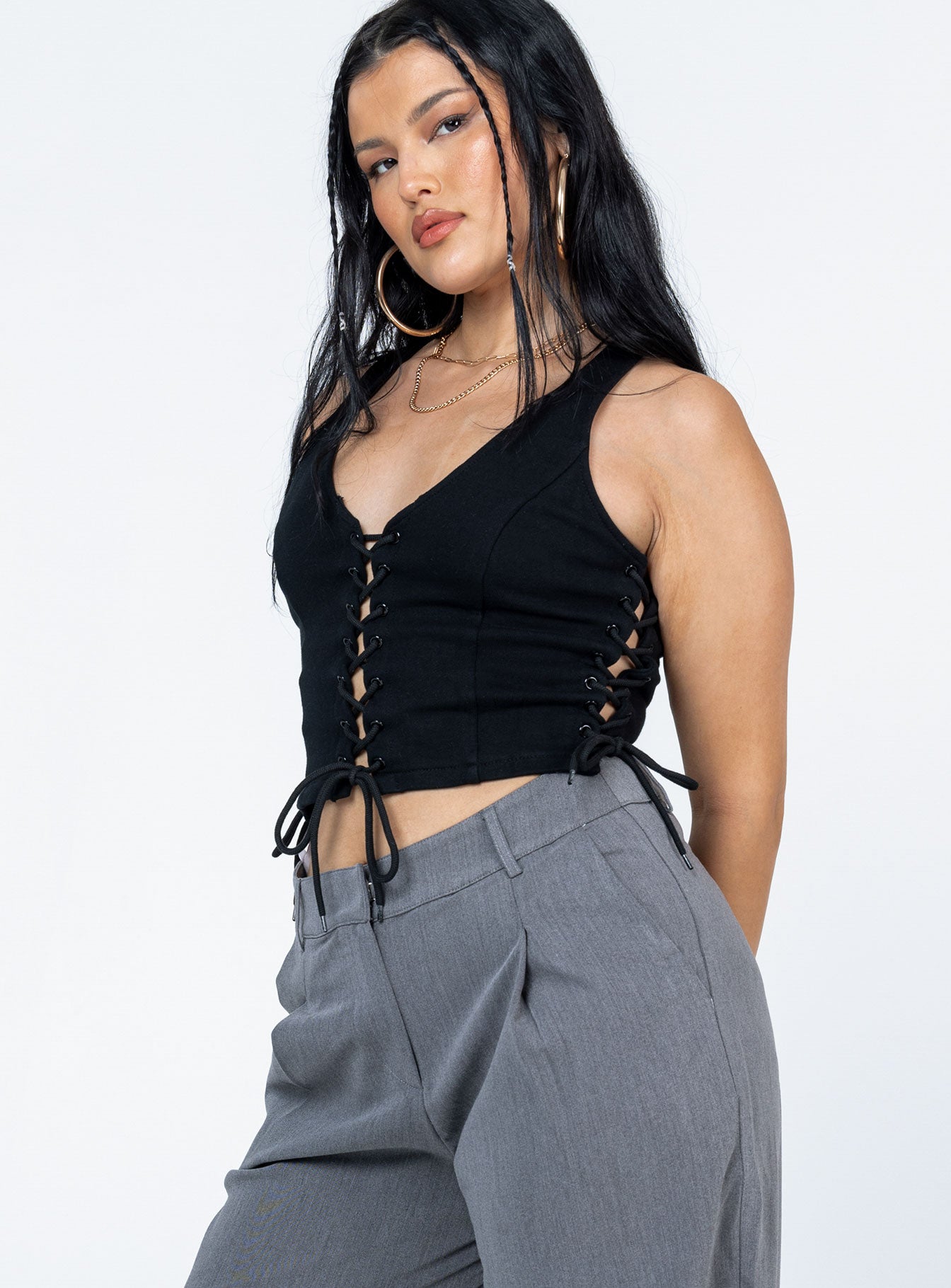 side view of model wearing Princess Polly Walker Top Black Sleeveless Scoop Neck 