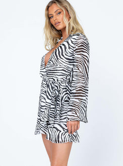 side view of model wearing Princess Polly Marty Long Sleeve Mini Dress Zebra 