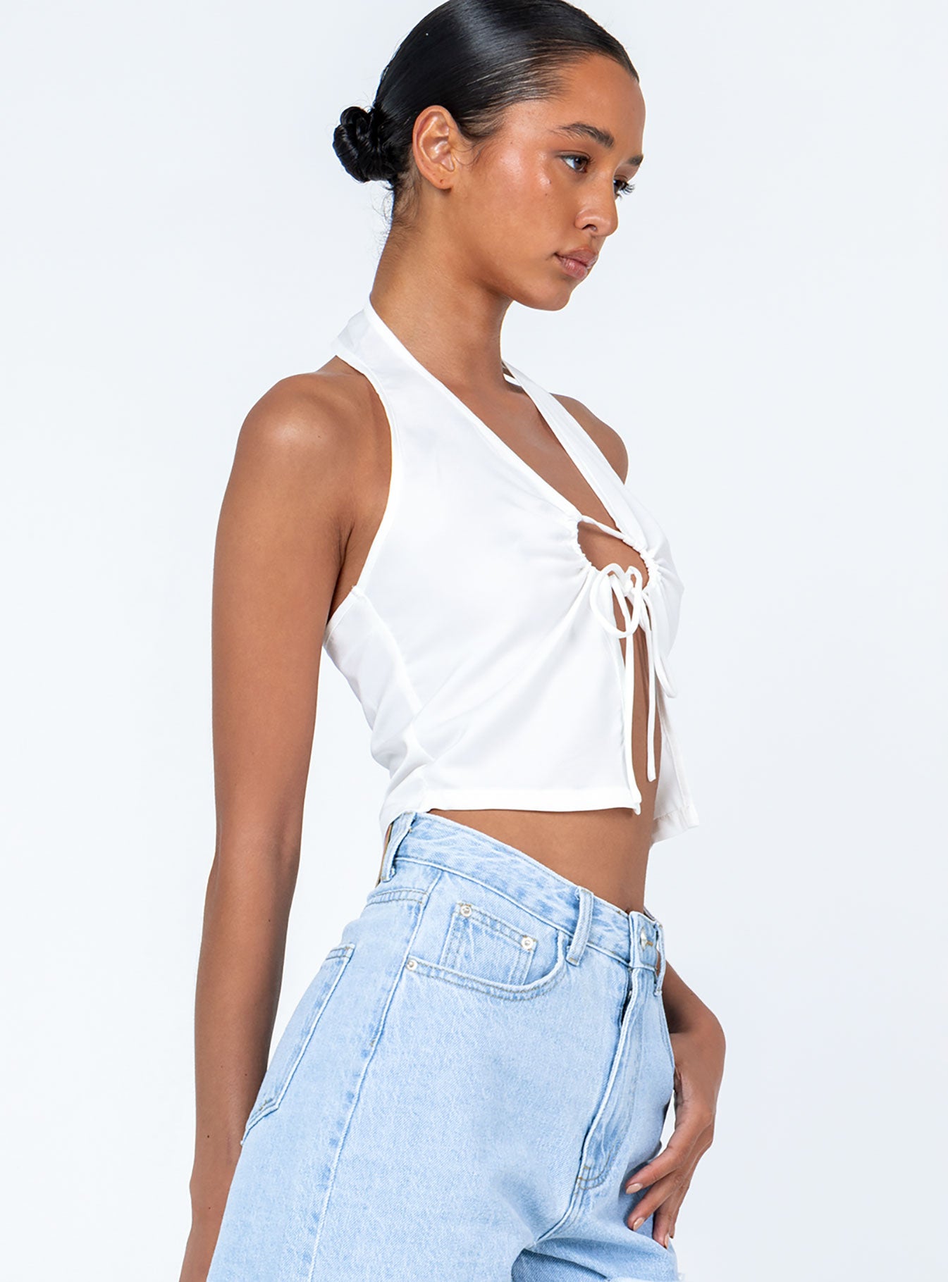 side view of model wearing Princess Polly Gilroy Top White Sleeveless Plunger 