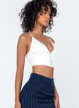 White top Silky material Adjustable shoulder straps  Lace up detail at front  Zip fastening at back 