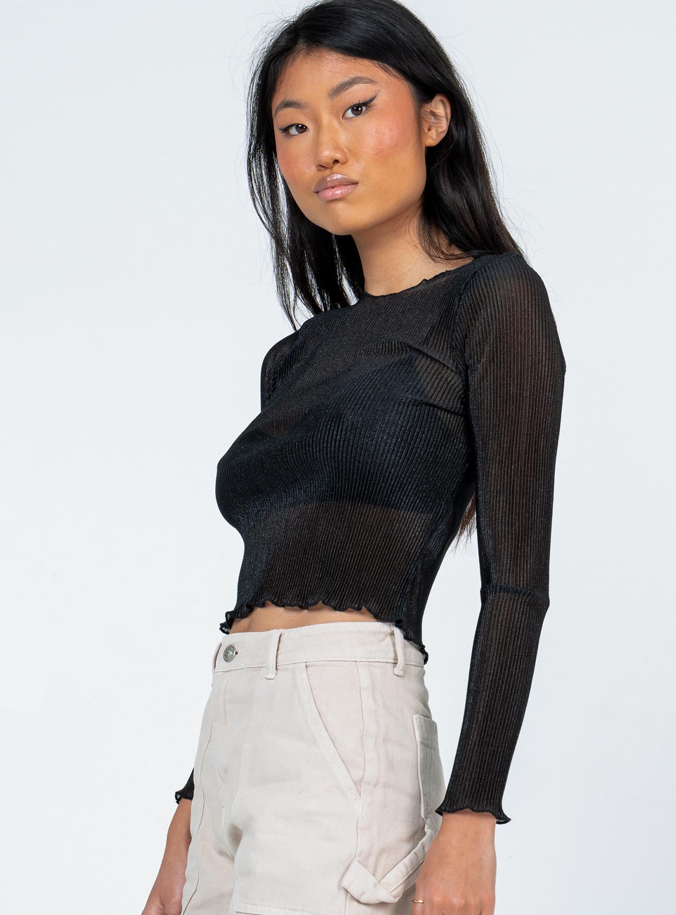 side view of model wearing Princess Polly Nima Long Sleeve Top Black 