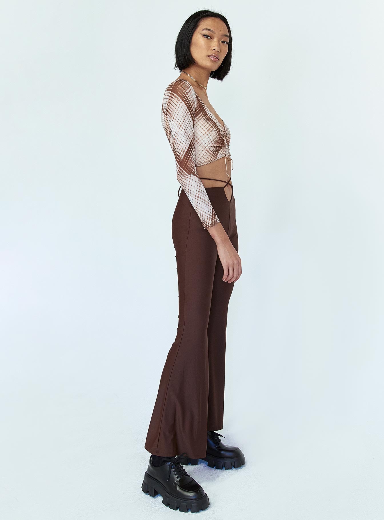 side view of model wearing Princess Polly Cooper Tie Waist Pants Brown 