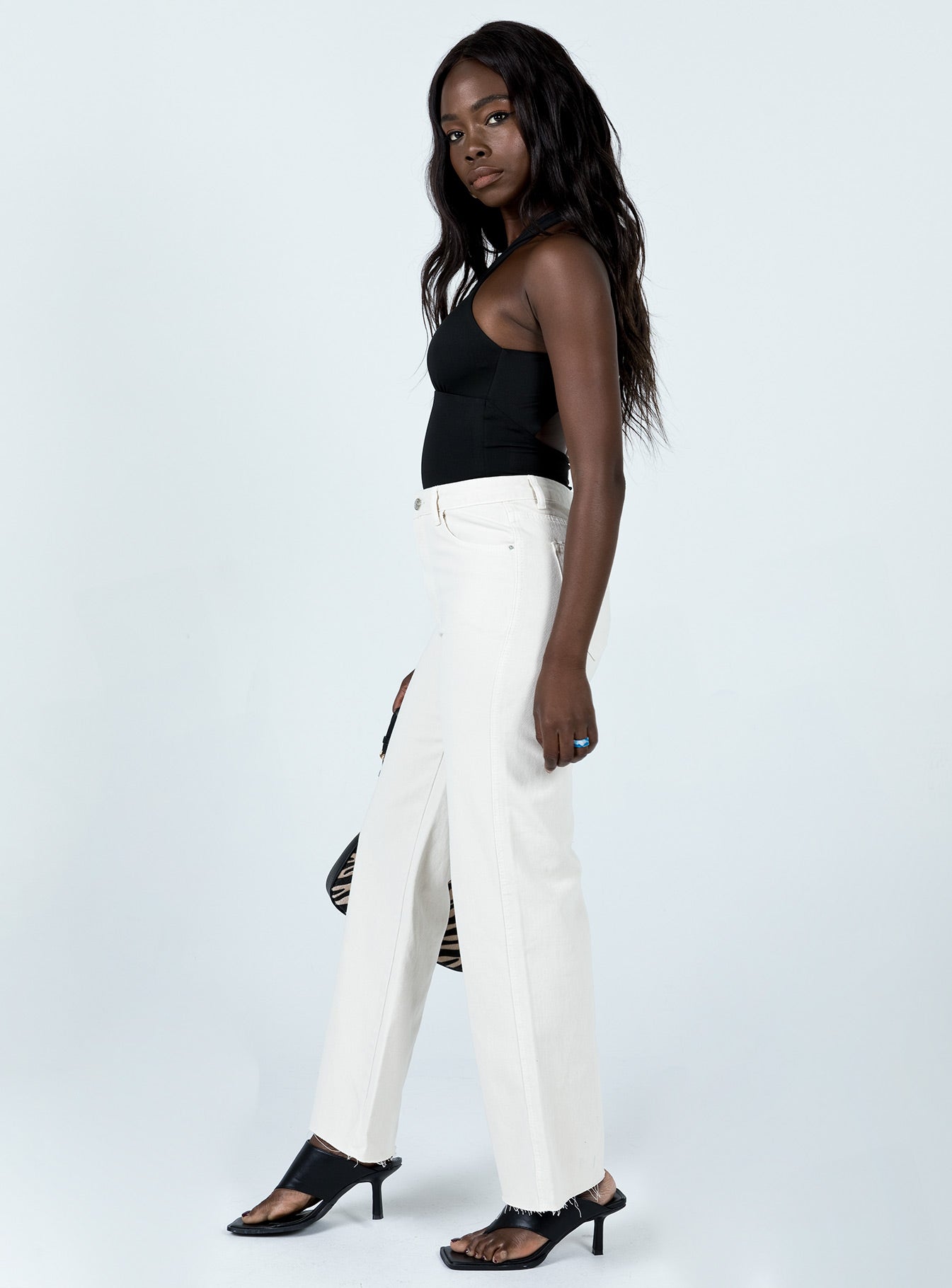 side view of model wearing Princess Polly Mamaia Straight Leg Denim Jeans Cream Low Rise Jeans 