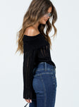 Off the shoulder top Sheer knit material Folded neckline Inner silicone strip at bust Flared sleeves