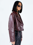 Oversized jacket Faux leather material  Lapel collar  Zip front fastening Twin hip pockets Removable buckle belt Zip at cuffs 