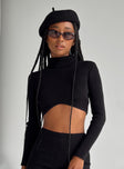Long sleeve top Ribbed material Turtle neck design Scooped hem