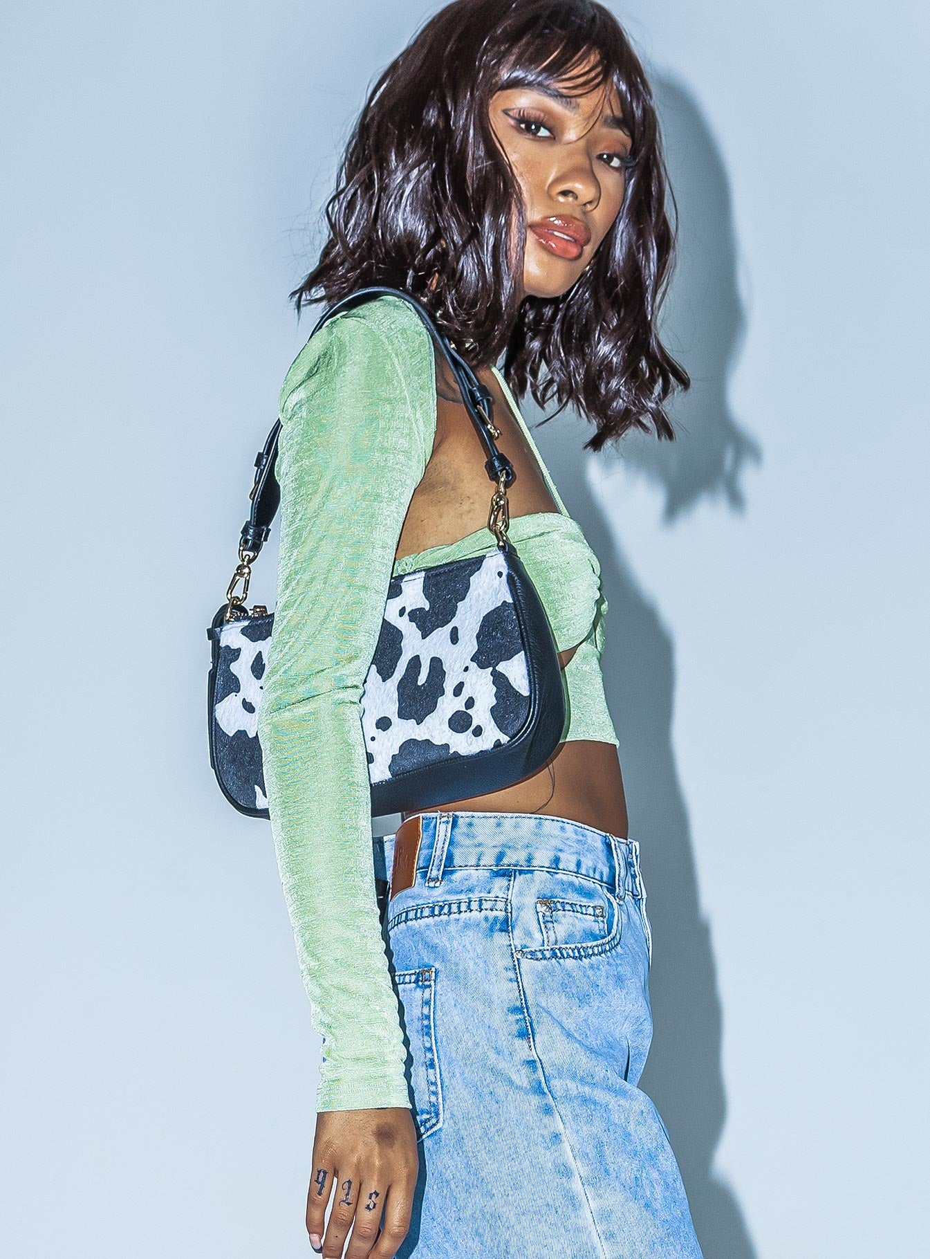 side view of model wearing Princess Polly Malaya Long Sleeve Top Green 