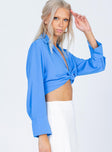 side view of model wearing Princess Polly French Kiss Twist Shirt Blue 