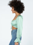 side view of model wearing Princess Polly Jolie Long Sleeve Top Green 