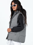 Oversized puffer vest High neck Front zip fastening Twin hip pockets Adjustable drawstring hem