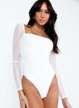 front view of model wearing Princess Polly Sussock Long Sleeve Bodysuit White Full Sleeves Square Neck 