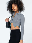 side view of model wearing Princess Polly Tavi Long Sleeve Top Black 