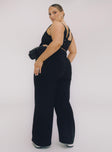 Black matching set Crop top Fixed straps Invisible zip fasting at side High waisted pants Wide relaxed leg Belt loops at waist Zip & button fastening