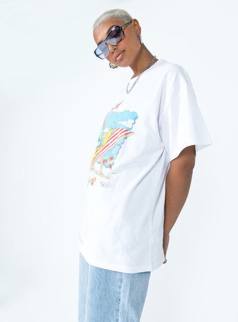 side view of model wearing Princess Polly Tweety Post Card Vacation Oversized Tee White Short Sleeve Crew Neck 
