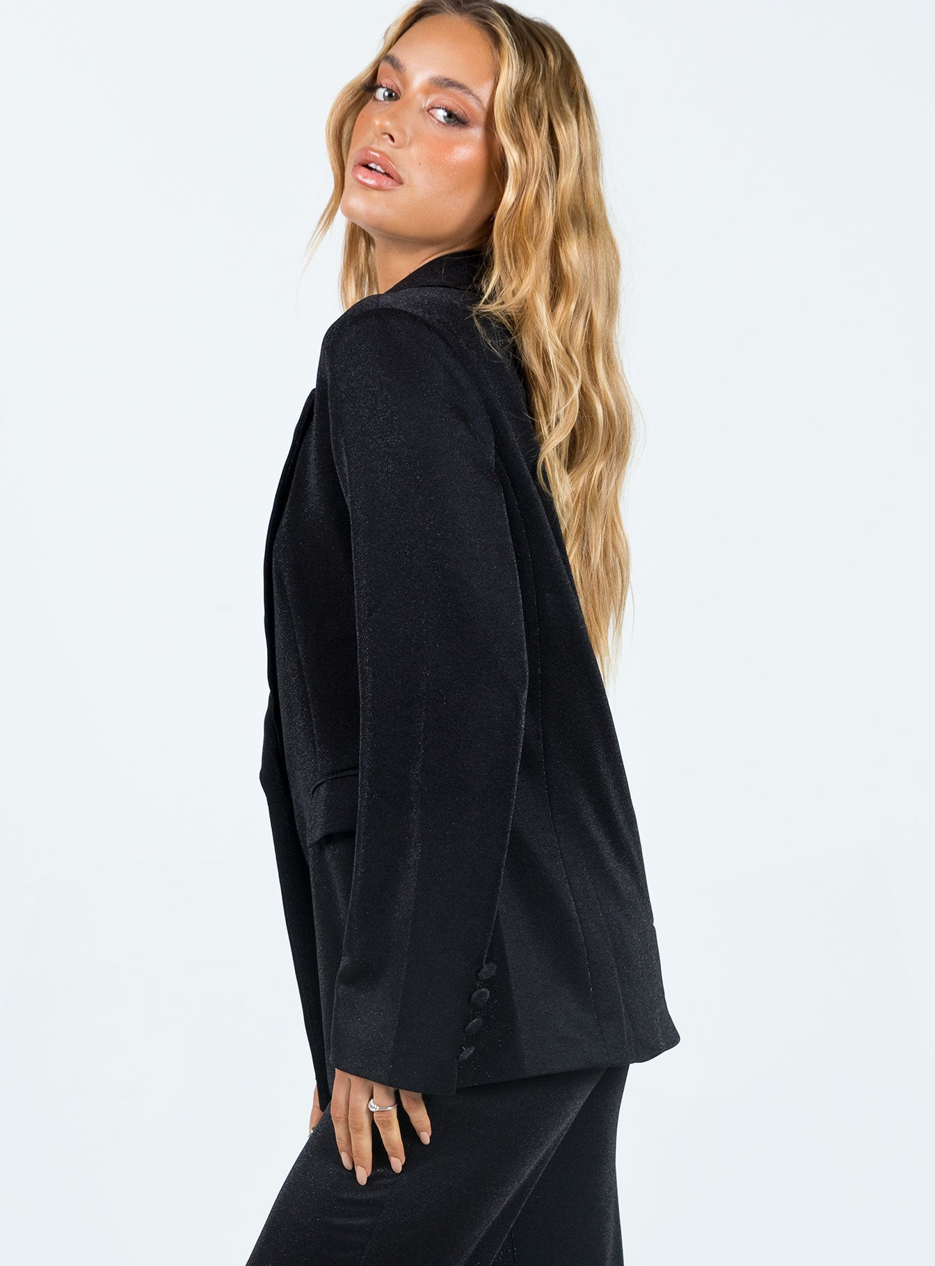 Blazer Glittery material Lapen collar Twin front pockets Button detail at cuff