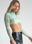 side view of model wearing Princess Polly Remus Long Sleeve Top Green 